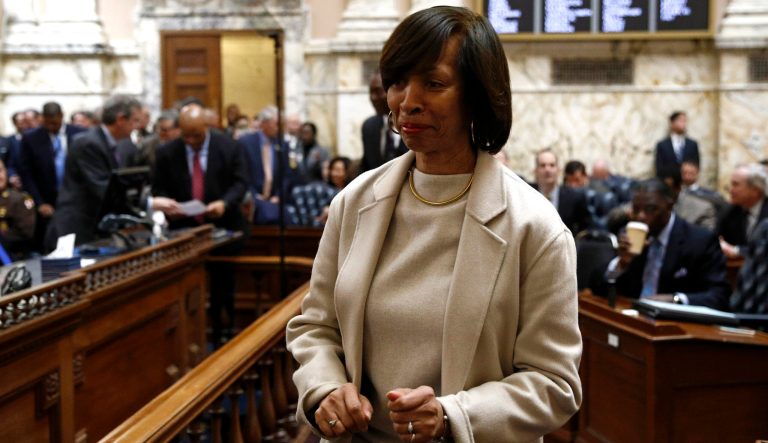 Baltimore Mayor Catherine Pugh walks on the Maryland House of Delegates chamber floor before Gov. Larry Hogan's annual State of the State address to a joint session of the legislature in Annapolis, Md., Wednesday, Jan. 30, 2019. 