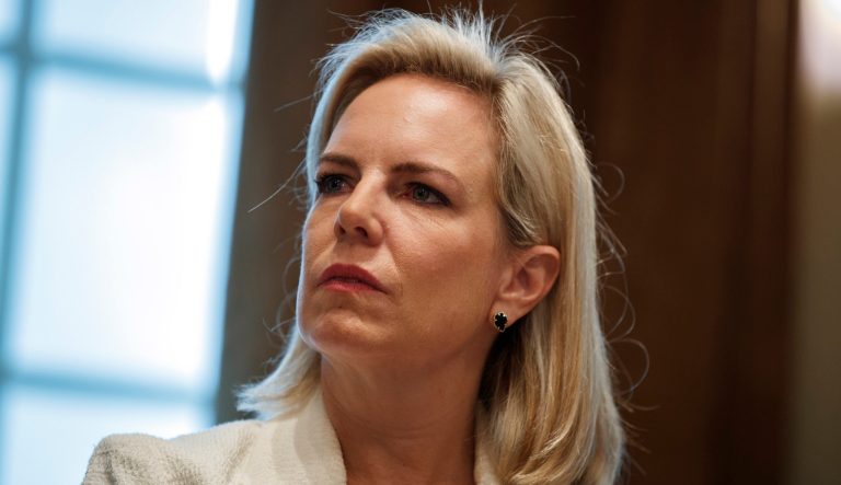 Secretary of Homeland Security Kirstjen Nielsen listens as President Donald Trump speaks during an event on human trafficking in the Cabinet Room of the White House, Friday, Feb. 1, 2019, in Washington. 