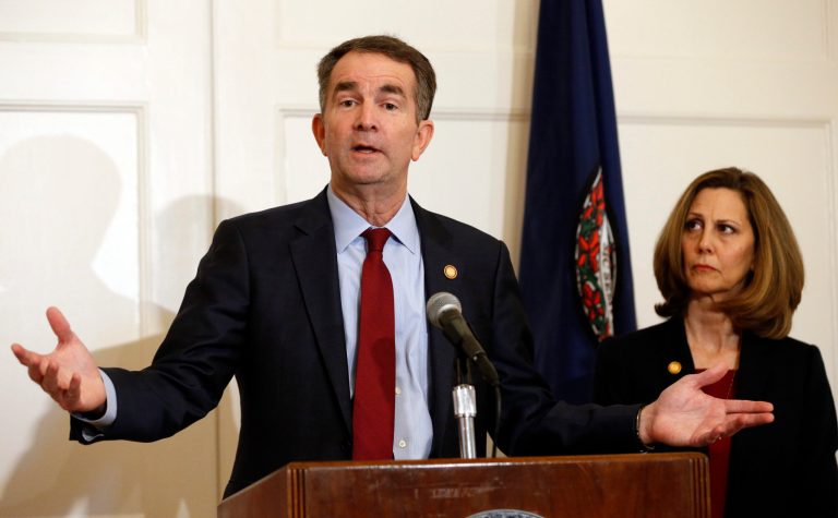 Virginia Gov. Ralph Northam, left, accompanied by his wife, Pam, speaks during a news conference in the Governor's Mansion in Richmond, Va., on Saturday, Feb. 2, 2019. Resisting widespread calls for his resignation, Northam on Saturday vowed to remain in office after disavowing a racist photograph that appeared under his name in his 1984 medical school yearbook. 