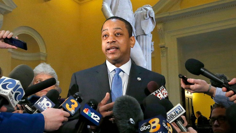 Virginia Lt. Gov. Justin Fairfax, center, answers questions from the media.