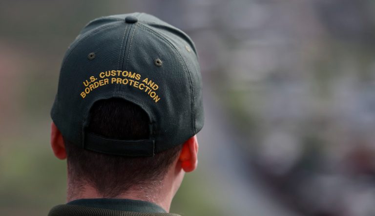 Border Patrol agent Vincent Pirro looks on near a border wall that separates the cities of Tijuana, Mexico, and San Diego, Tuesday, Feb. 5, 2019, in San Diego. 