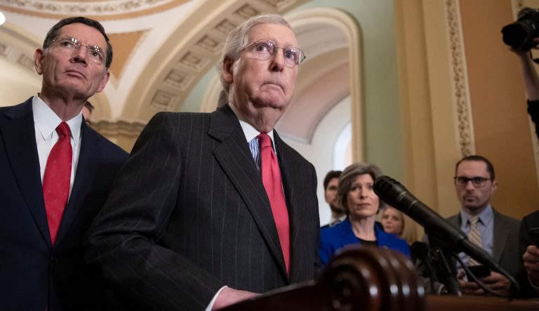 Senate Majority Leader Mitch McConnell, R-Ky., joined at left by Sen. John Barrasso, R-Wyo., speaks to reporters in advance of President Donald Trump's State of the Union speech, on Capitol Hill in Washington, Tuesday, Feb. 5, 2019. 