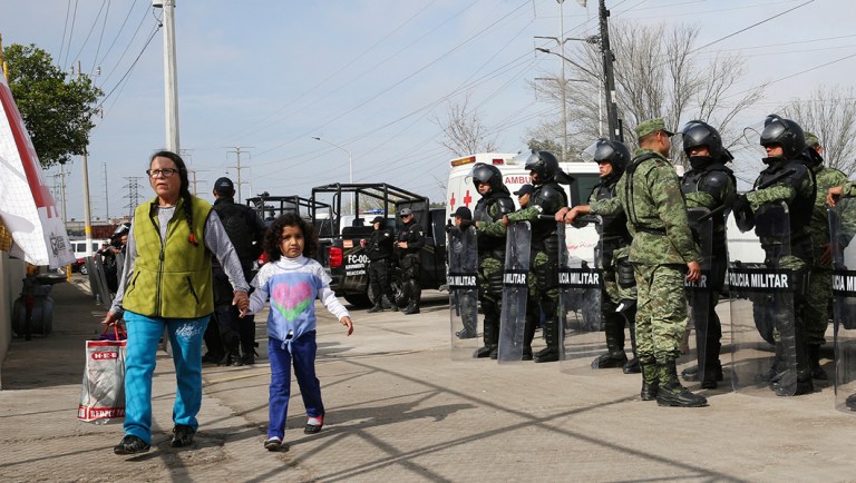 A woman arrives with donations at a shelter housing Central American immigrants in Piedras Negras, Mexico, Tuesday, Feb. 5, 2019.