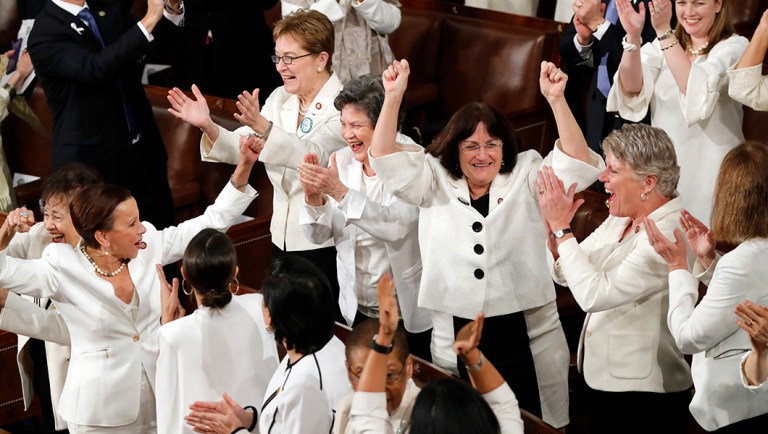 Women members of Congress cheer after President Trump acknowledges more women in Congress during his State of the Union address.