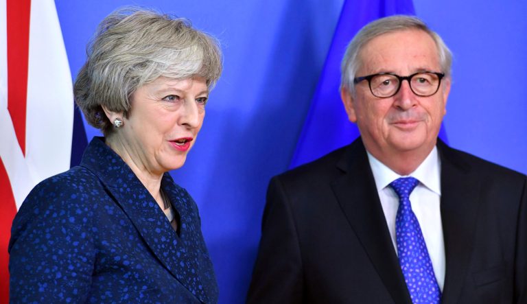 European Commission President Jean-Claude Juncker stands with British Prime Minister Theresa May before their meeting at the European Commission headquarters in Brussels, Thursday, Feb. 7, 2019. 