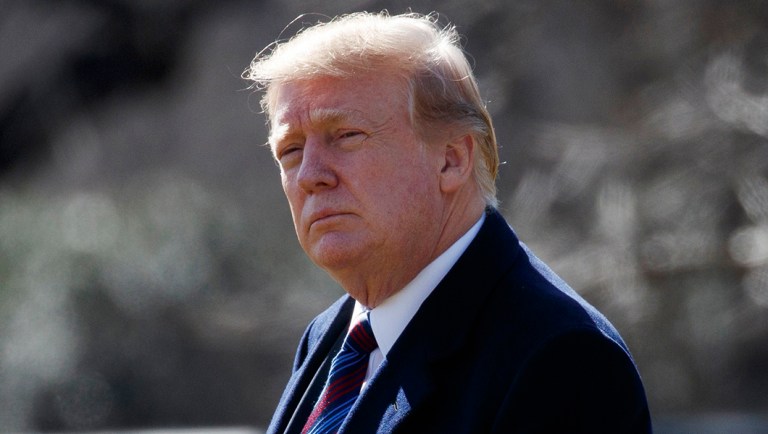 President Trump walks to board Marine One for a trip to Walter Reed National Military Medical Center.