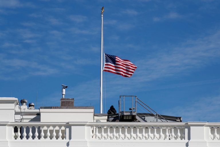 The flag of the United States is lowered to half-staff at the White House.