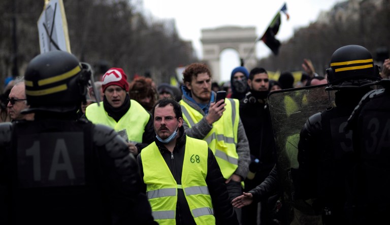 Yellow vest protesters walk down the famed Champs Elysees avenue to keep pressure on French President Emmanuel Macron's government, for the 13th straight weekend of demonstrations, in Paris, France.