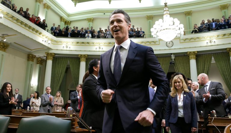 California Gov. Gavin Newsom walks up up the center aisle of the Assembly Changers to deliver his first of the state address to a joint session of the legislature at the Capitol Tuesday, Feb. 12, 2019, in Sacramento, Calif. 