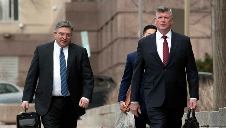 Members of the defense team for Paul Manafort, from left, Richard Westling, Tim Wang and Kevin Downing, walk to federal court.