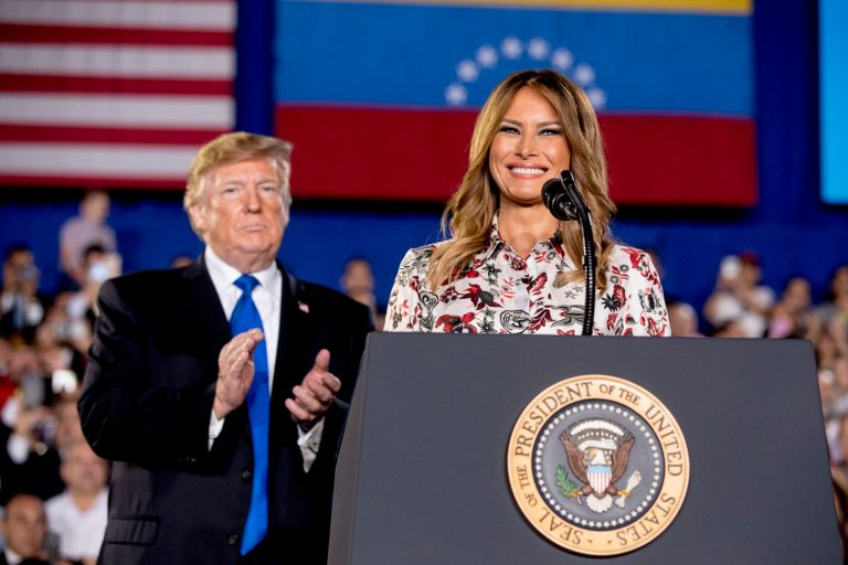 First lady Melania Trump, accompanied by President Donald Trump.