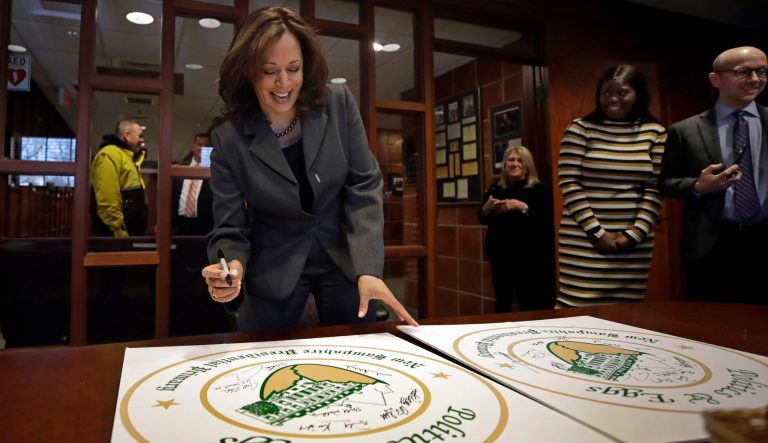 Democratic presidential candidate Sen. Kamala Harris, D-Calif., signs posters at a Politics & Eggs campaign event, Tuesday, Feb. 19, 2019, in Manchester, N.H. 