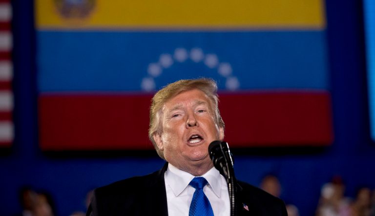 In this Monday, Feb. 18, 2019 photo, President Donald Trump speaks to a Venezuelan American community at Florida Ocean Bank Convocation Center at Florida International University in Miami, Fla., to speak out against President Nicolas Maduro's government and its socialist policies. 