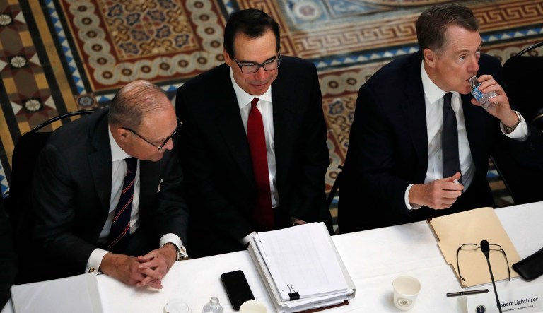White House economic adviser Larry Kudlow, left, Treasury Secretary Steve Mnuchin, and U.S. Trade Representative Robert Lighthizer, attend a meeting of senior U.S. and Chinese officials to resume trade negotiations, Thursday, Feb. 21, 2019, in the Indian Treaty Room of the Eisenhower Executive Office Building at the White House complex, in Washington. 