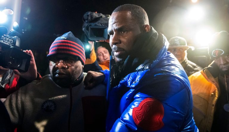 R. Kelly surrenders to authorities at Chicago First District police station, Friday, Feb. 22, 2019.