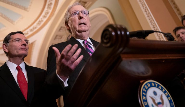 Senate Majority Leader Mitch McConnell, R-Ky., joined at left by Sen. John Barrasso, R-Wyo., told reporters he can't say whether the Republican-controlled Senate will approve a resolution to block President Donald Trump's emergency declaration on immigration, during a news conference on Capitol Hill in Washington, Tuesday, Feb. 26, 2019.