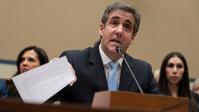 Michael Cohen reads an opening statement.