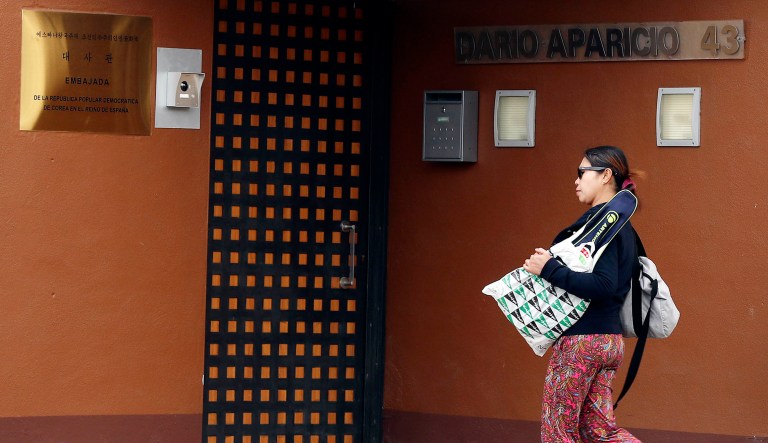 A woman walks past North Korea's embassy in Madrid, Spain.