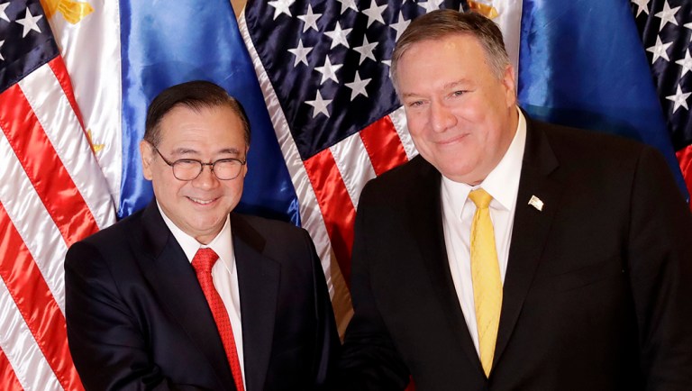 Philippine Foreign Affairs Secretary Teodoro Locsin Jr., left, and Secretary of State Mike Pompeo shake hands prior to their bilateral meeting.