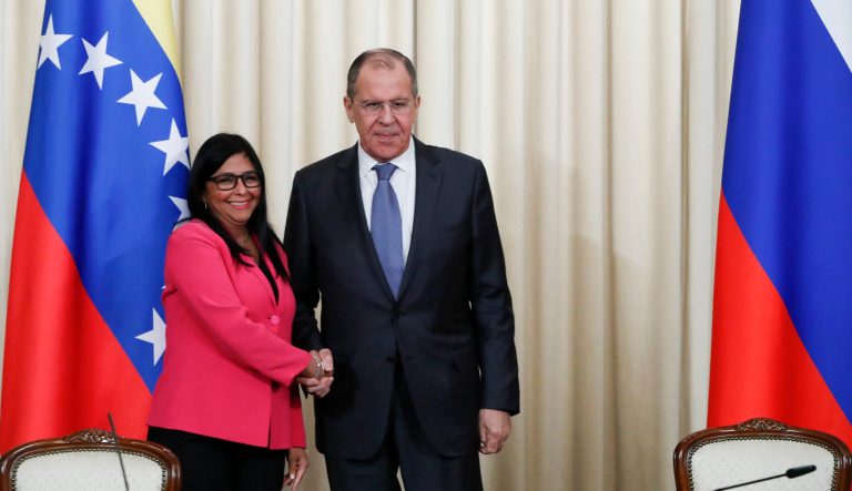 Russian Foreign Minister Sergey Lavrov, centre and Venezuela's Vice President Delcy Rodriguez shake hands after a joint news conference following their talks in Moscow, Russia, Friday, March 1, 2019. 