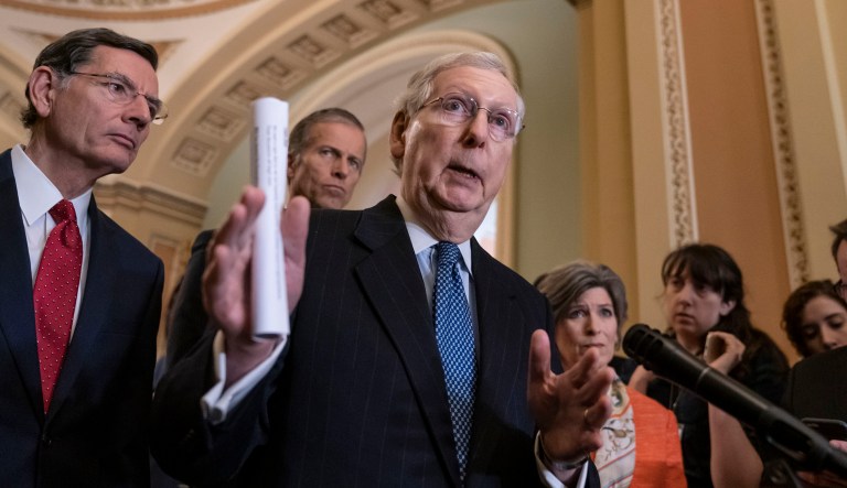 Senate Majority Leader Mitch McConnell, R-Kentucky, is seen with other senators on Capitol Hill in Washington.