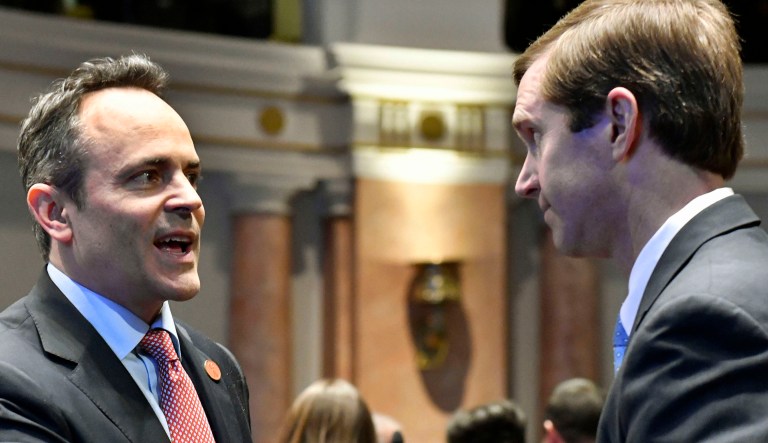 Kentucky Gov. Matt Bevin, left, shakes hands with Kentucky Attorney General Andy Beshear.