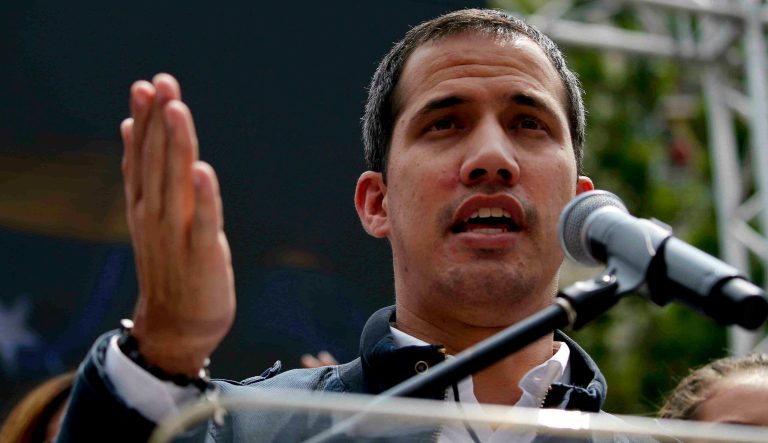 Venezuelan opposition leader Juan Guaido, who has declared himself interim president, speaks to supporters at a rally to commemorate International Women's Day in Caracas, Venezuela, Friday, March 8, 2019.