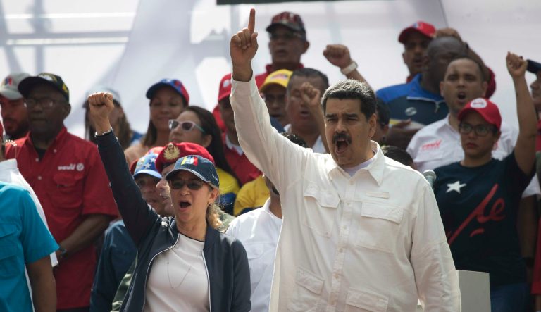 Venezuela's President Nicolas Maduro and first lady Cilia Flores chant, "Yankees go home" during a pro-government rally in Caracas, Venezuela, Saturday, March 9, 2019. 
