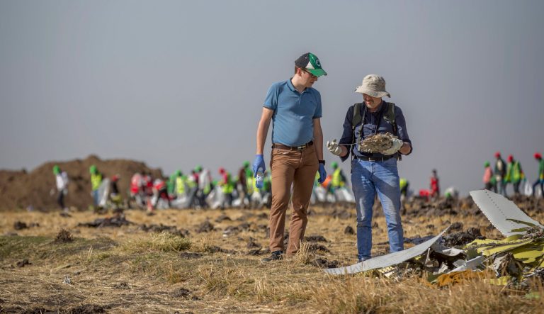 Foreign investigators examine wreckage at the scene where the Ethiopian Airlines Boeing 737 Max 8 crashed shortly after takeoff on Sunday killing all 157 on board, near Bishoftu, or Debre Zeit, south of Addis Ababa, in Ethiopia Tuesday, March 12, 2019.