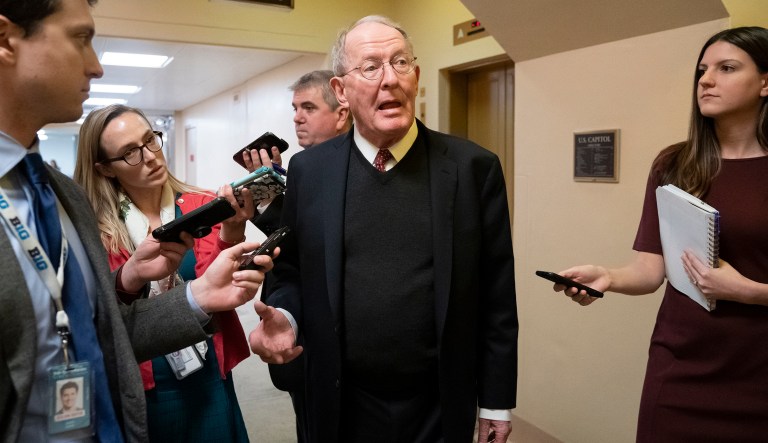 Sen. Lamar Alexander, R-Tenn., tells reporters that he will vote for a resolution to annul President Donald Trump's declaration of a national emergency at the southwest border, on Capitol Hill in Washington, Thursday, March 14, 2019.