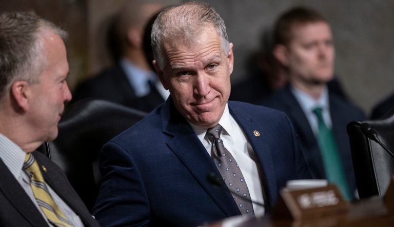 Sen. Thom Tillis, R-N.C., joined at left by Sen. Dan Sullivan, R-Alaska, attends a Senate Armed Services hearing on Capitol Hill in Washington, prior to the vote on President Donald Trump's national emergency at the border, Thursday, March 14, 2019. 