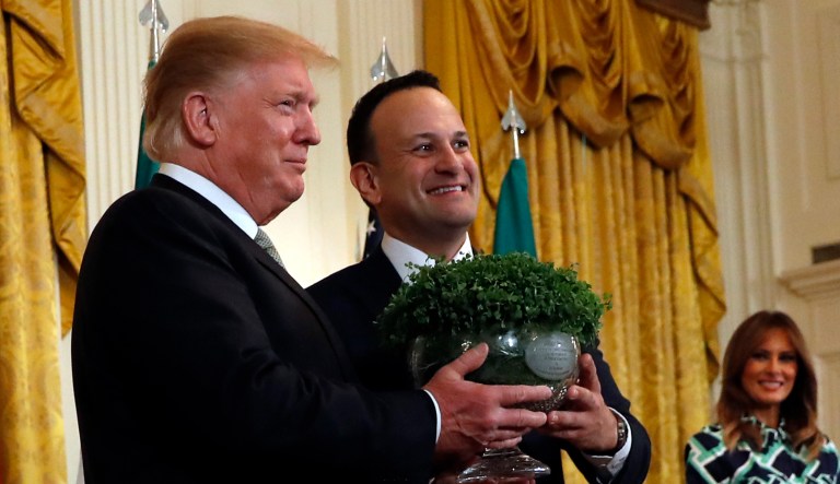 President Trump and Irish Prime Minister Leo Varadkar hold a bowl of shamrocks during the annual presentation of a bowl of shamrocks in the East Room of the White House in Washington, D.C.