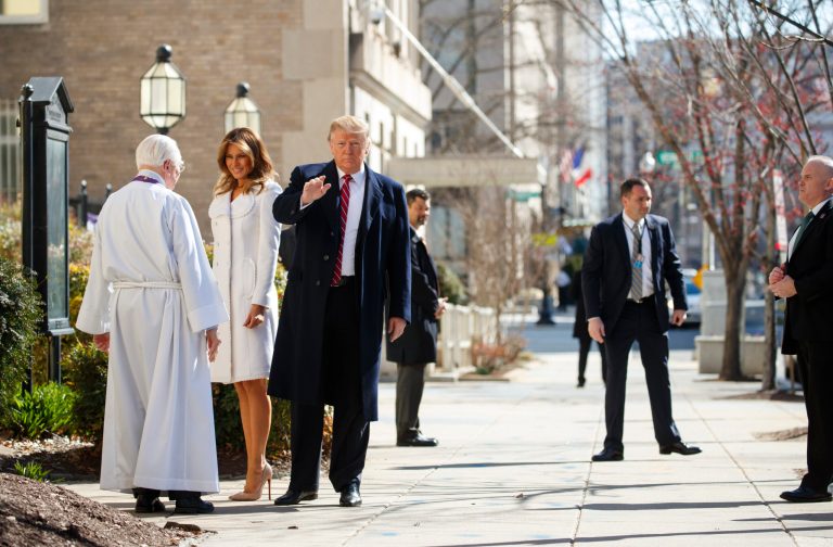 President Donald Trump and first lady Melania Trump with Reverend Bruce McPherson arrive to attend service at Saint John's Church in Washington, Sunday, March 17, 2019.