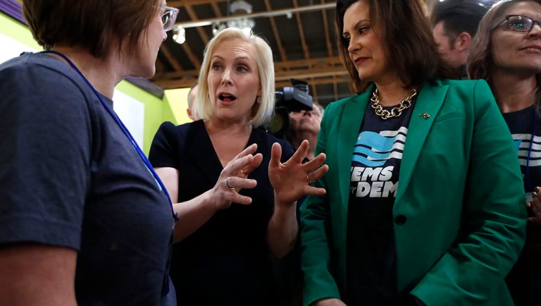Democratic presidential candidate Sen. Kirsten Gillibrand, D-N.Y., center, talks.