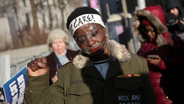 Therese Okoumou poses for pictures and rallies with supporters.