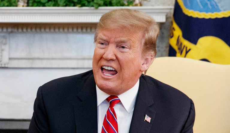 President Trump speaks during a meeting in the White House.