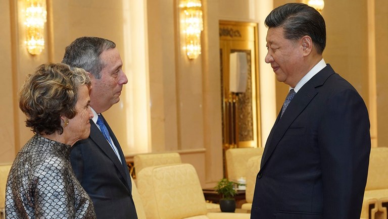 Chinese President Xi Jinping, right, talks to Harvard University President Lawrence Bacow and his wife Adele Fleet Bacow at The Great Hall Of The People.