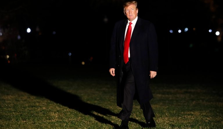 President Donald Trump walks across the South Lawn on return to the White House from Ohio, Wednesday, March 20, 2019, in Washington. 