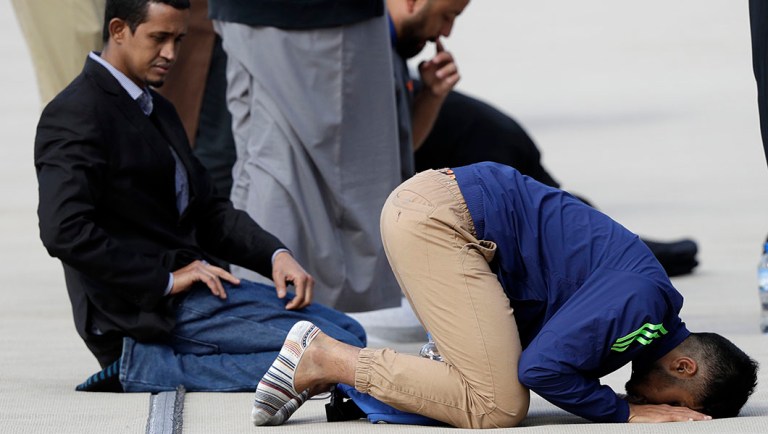 Muslims pray ahead of Friday prayers at Hagley Park in Christchurch, New Zealand.