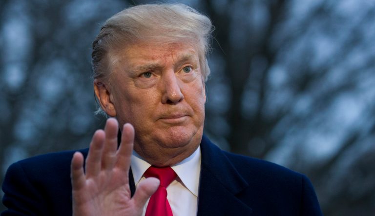 President Donald Trump waves after speaking with the media after stepping off Marine One on the South Lawn of the White House, Sunday, March 24, 2019, in Washington. 