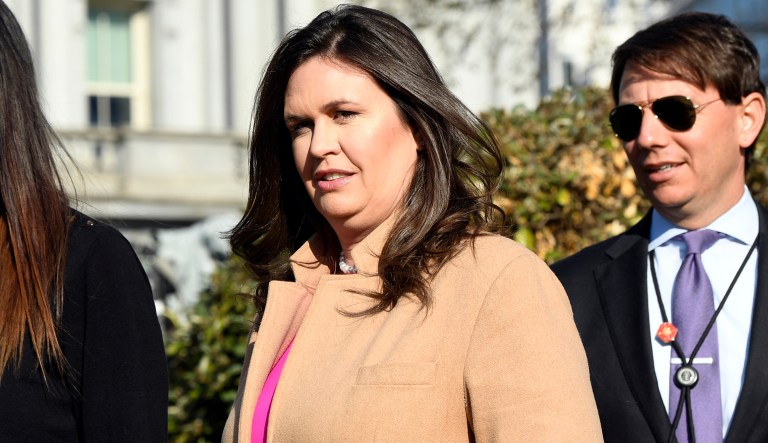 White House press secretary Sarah Sanders, left, walks with Deputy White House Press Secretary Hogan Gidley, right, to speak with reporters outside the West Wing of the White House in Washington, Monday, March 25, 2019.