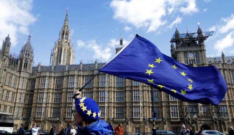 An anti Brexit campaigner shows her support for Europe waving a European Union flag outside Parliament in London, Monday, March 25, 2019.  British Prime Minister Theresa May is under intense pressure Monday to win support for her Brexit deal to split from Europe. 