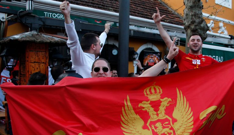 Montenegro soccer fans cheer prior to the Euro 2020 group A qualifying soccer match between Montenegro and England, in downtown Podgorica, Montenegro, Monday March 25, 2019. 