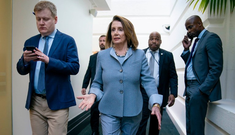 House Speaker Nancy Pelosi, D-Calif., walks to a Democratic Caucus meeting at the Capitol in Washington.