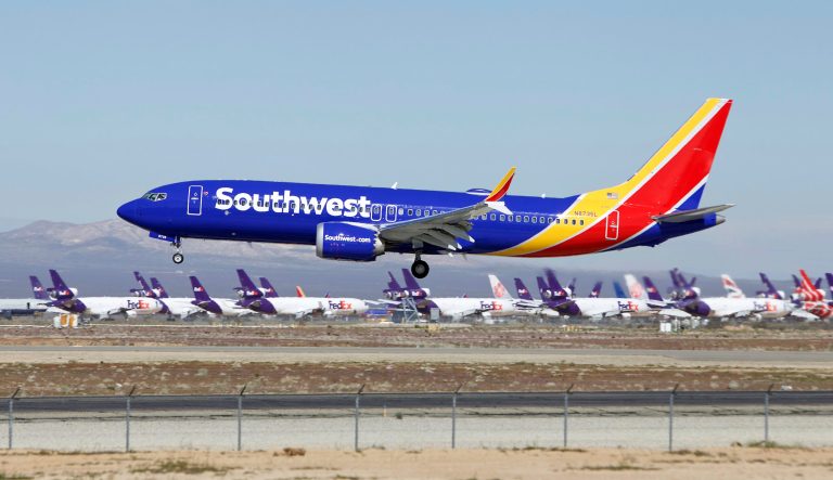 In this Saturday, March 23, 2019, photo, a Southwest Airlines Boeing 737 Max aircraft lands at the Southern California Logistics Airport in the high desert town of Victorville, Calif. Southwest, which has 34 Max aircraft, is making cancellations five days in advance, with an average of 130 daily cancellations. 