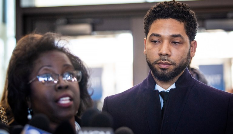 Actor Jussie Smollett, right, listens as his attorney, Patricia Brown Holmes, speaks to reporters at the Leighton Criminal Courthouse after prosecutors dropped all charges against him on Tuesday, March 26, 2019.