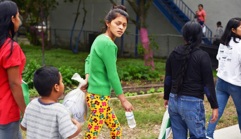 Migrant families arrive at Good Neighbor Settlement House after being released from a local detention center and escorted by U.S. Border Patrol to the non-profit multi-service agency for assistance Tuesday, March 26, 2019, in Brownsville, Texas.