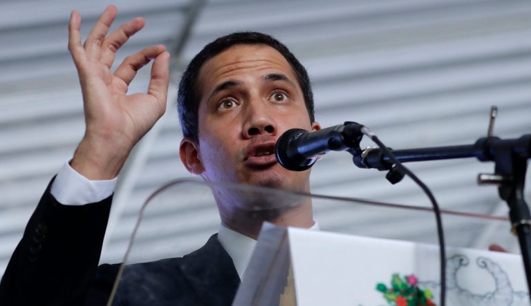Venezuela's self-proclaimed interim president Juan Guaido talks during a meeting with electricity experts in Caracas, Venezuela, Thursday, March 28, 2019. The Venezuelan government on Thursday said it has barred Guaido from holding public office for 15 years, though the National Assembly leader responded soon afterward that he would continue his campaign to oust President Nicolas Maduro.  