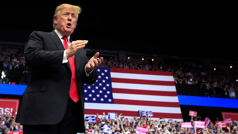 President Trump arrives to speak at a rally in Grand Rapids, Mich.