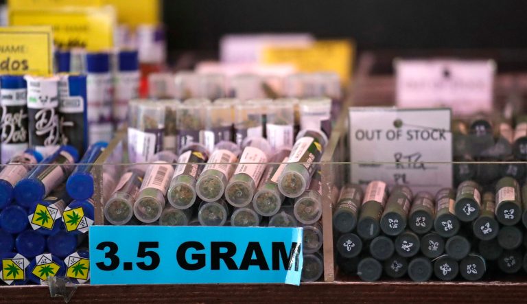 In this photo taken Thursday, March 28, 2019, pot products line a display case at a marijuana shop in Seattle. 